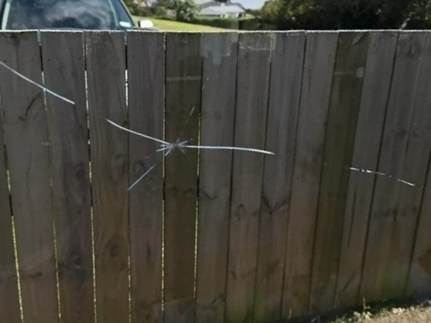 An impact crack starring out across a window pane