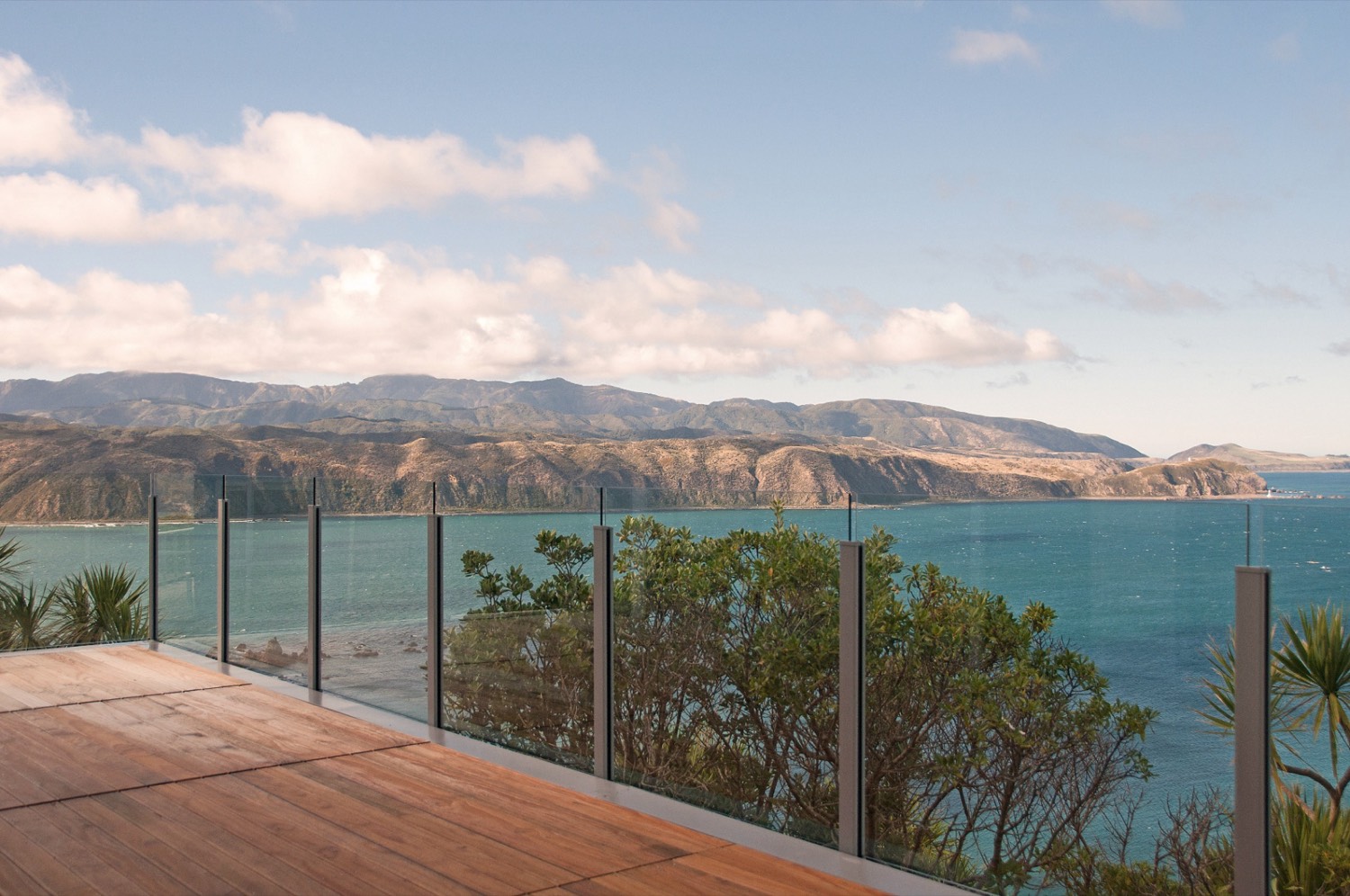 Frameless glass balustrade on a deck overlooking surrounding areas