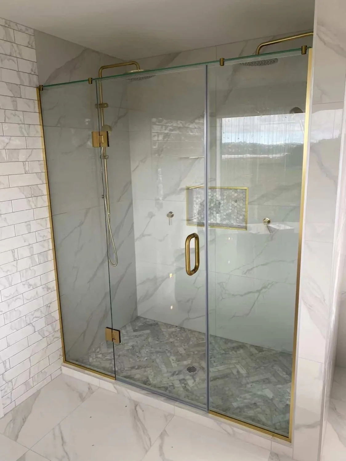 Brass hardware glass shower screen in Tauranga